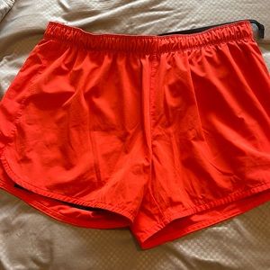 Red Nike running shorts